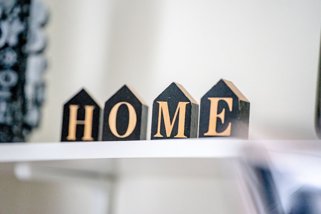 Stylish wooden block letters spelling HOME for cozy home decor.